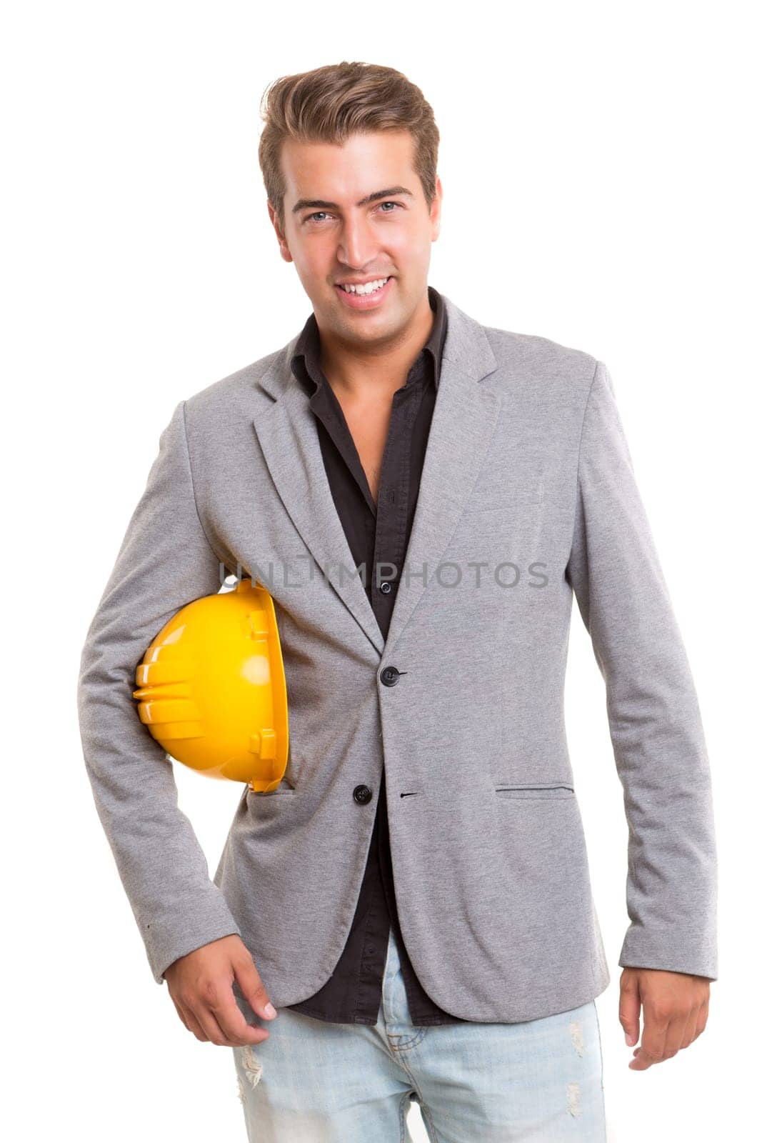 Handsome young engineer posing isolated over white background