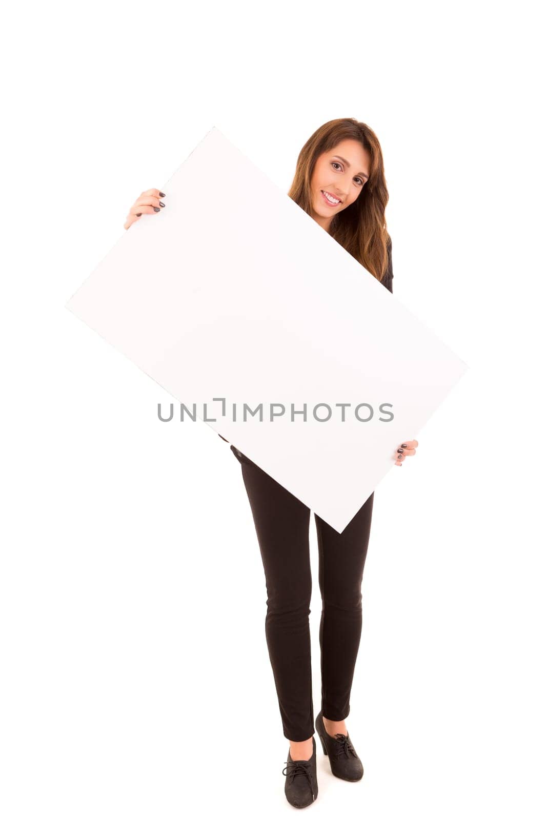 Beautiful young woman holding a white card - isolated over white