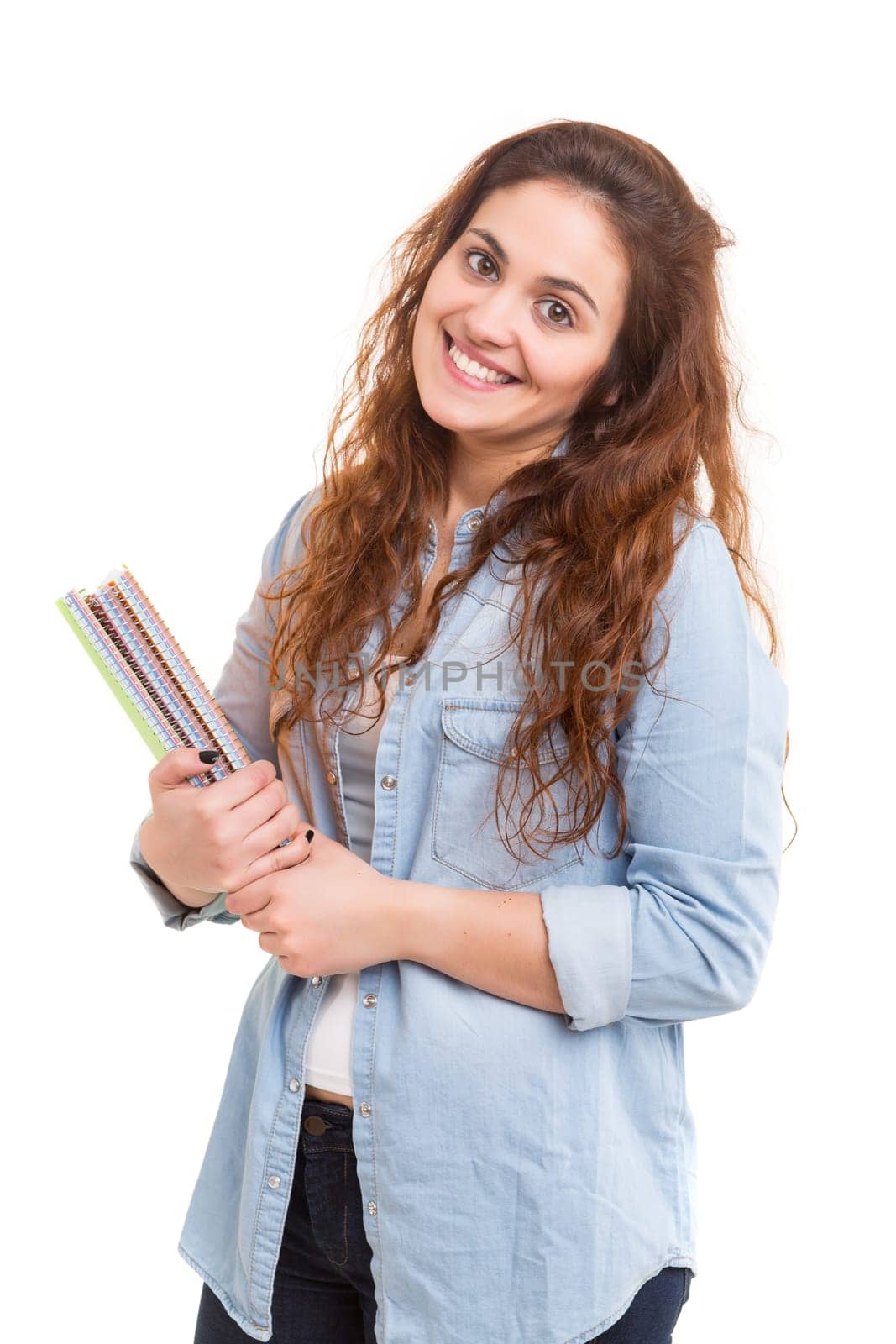 Young student posing over a white background