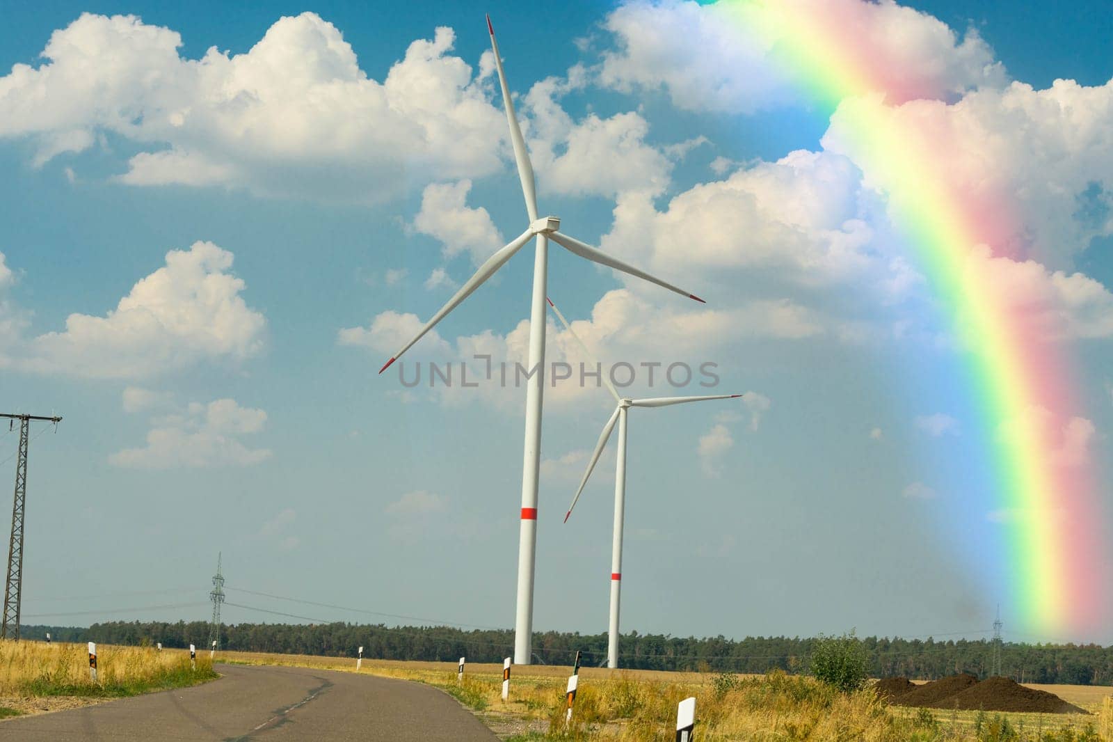 Sustainable green energy. Electric windmill generators in the sunrise