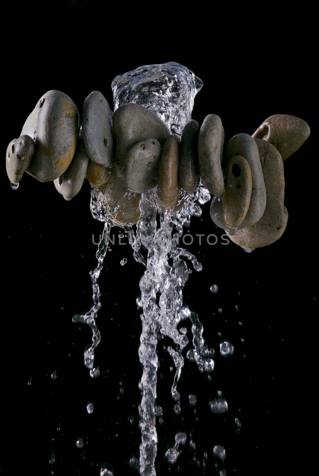 Water dripping from pebbles