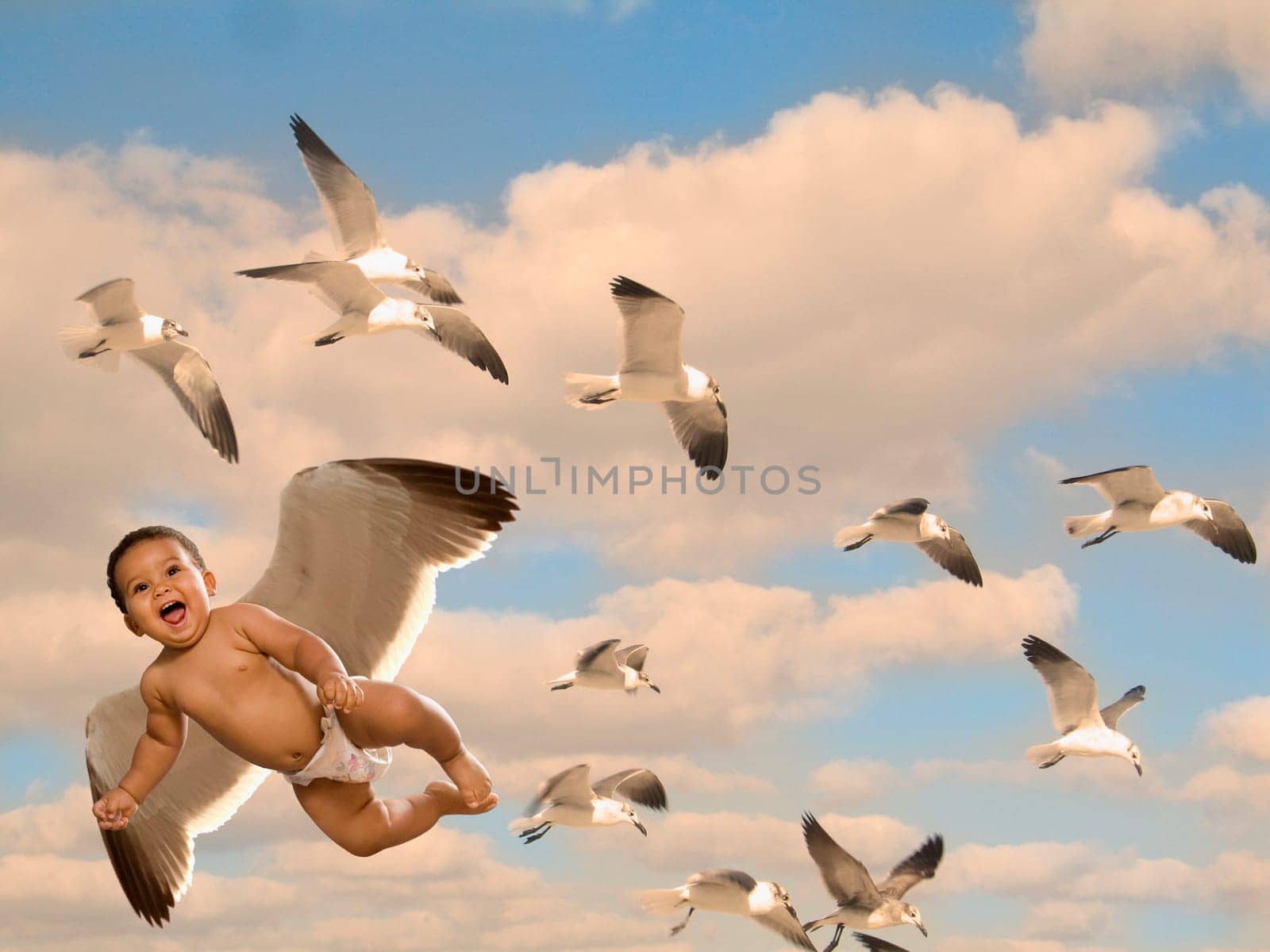 Low angle view of a baby boy flying