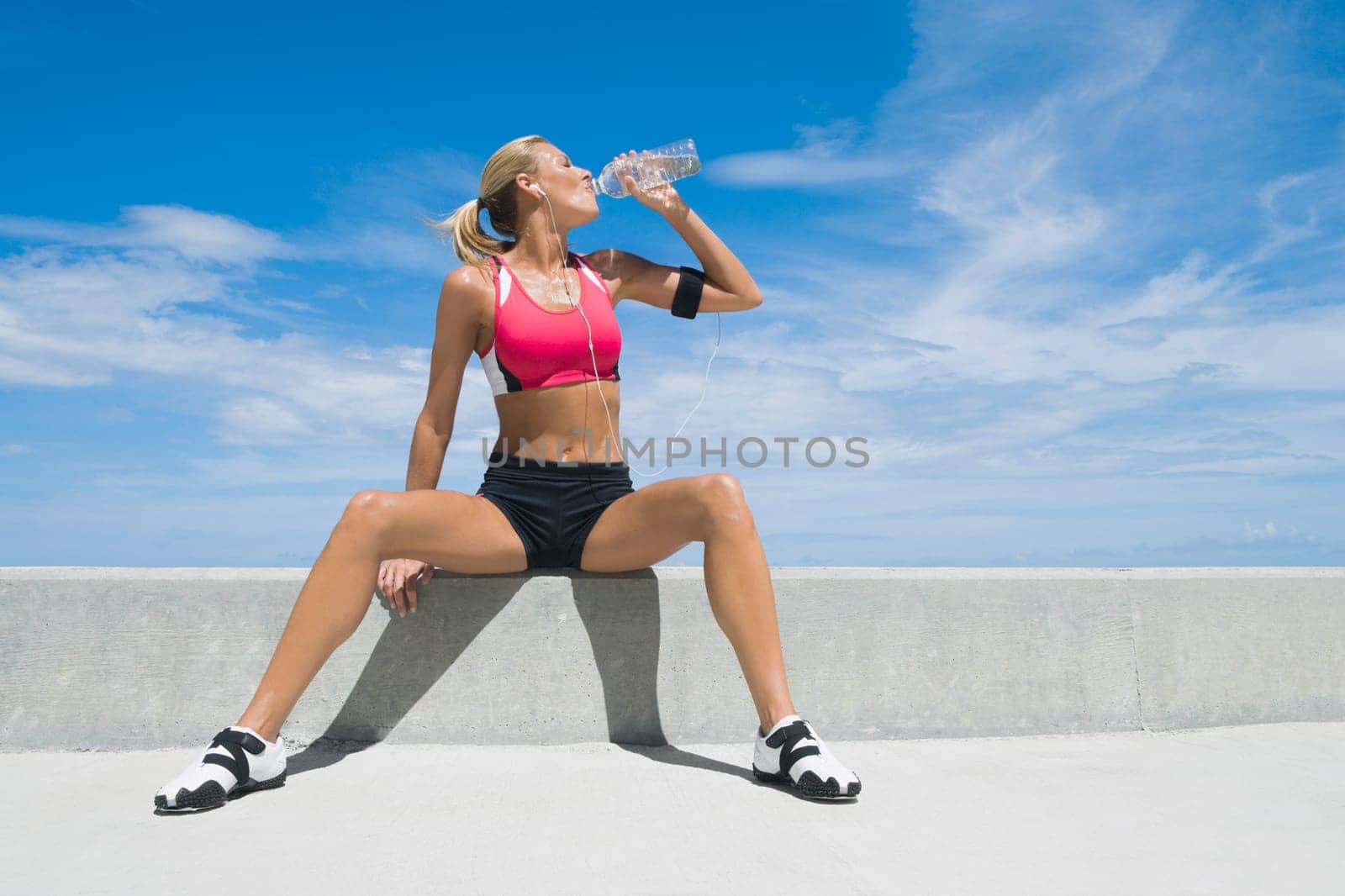 Mid adult woman drinking water from a water bottle