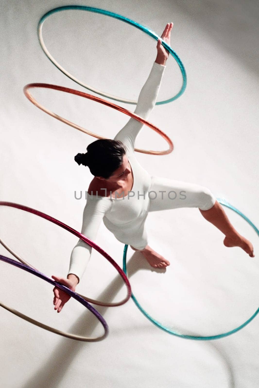 High angle view of a woman exercising with hula hoops