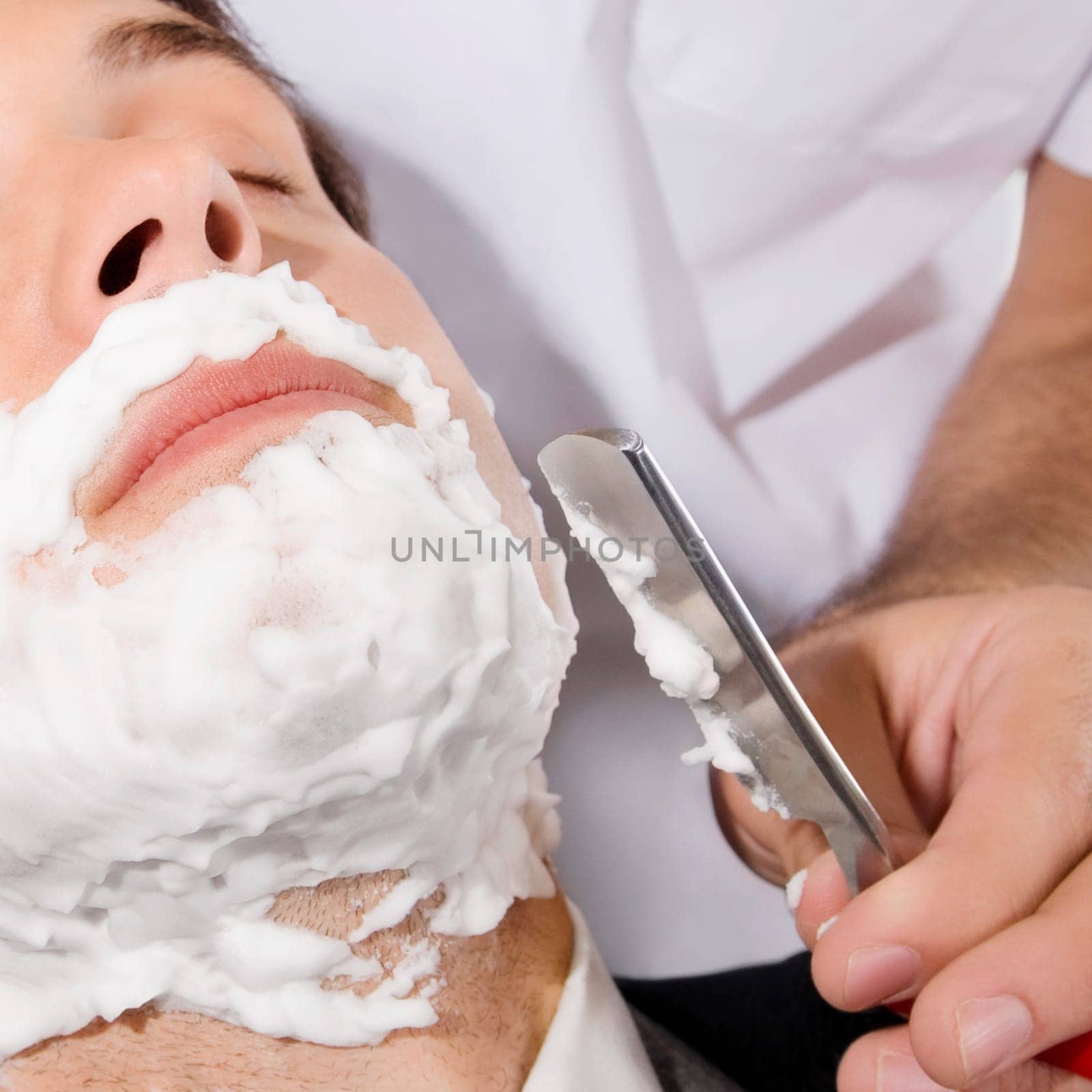 Man getting shaved in a salon