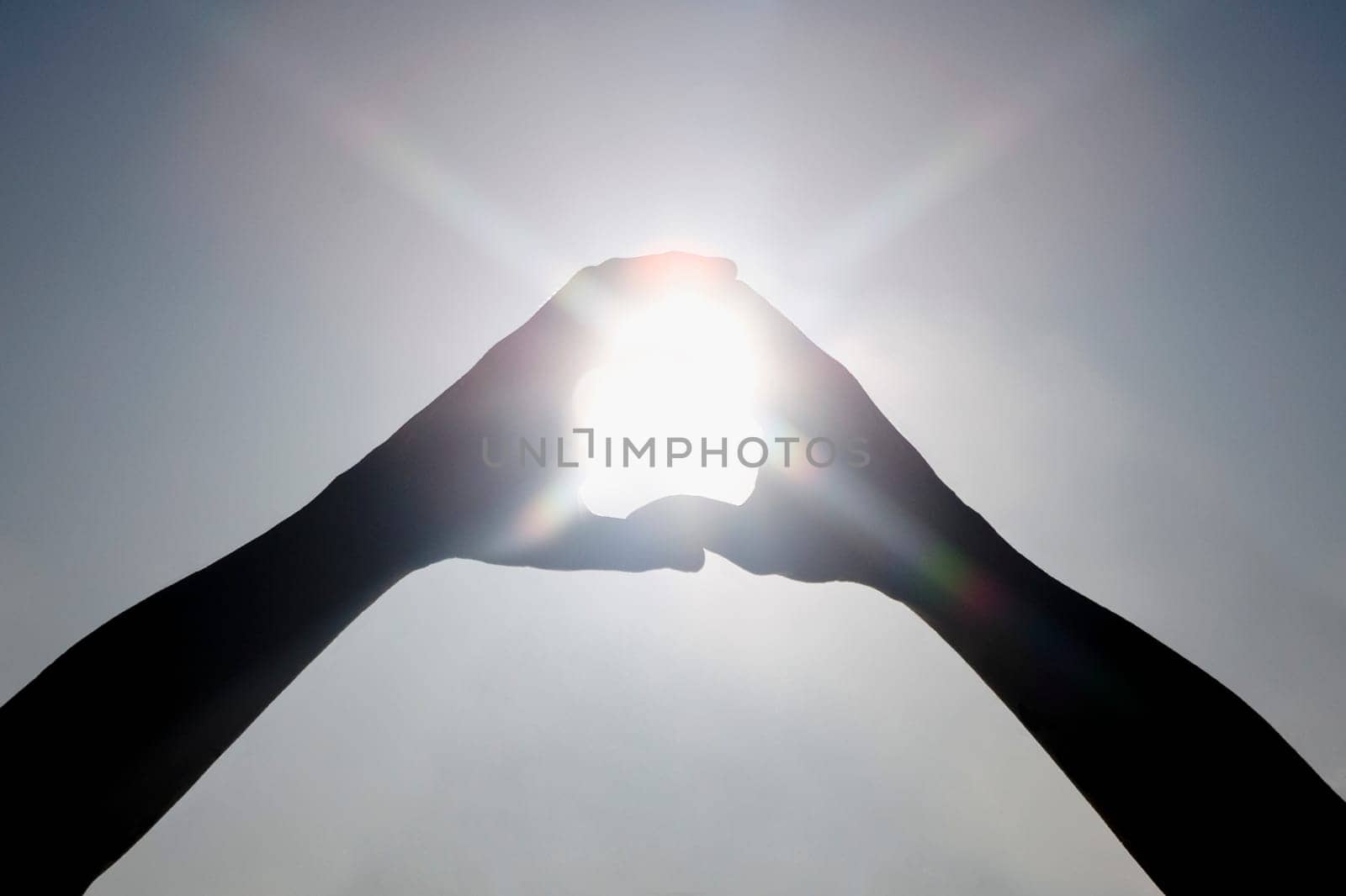 Sunlight shining through a finger frame