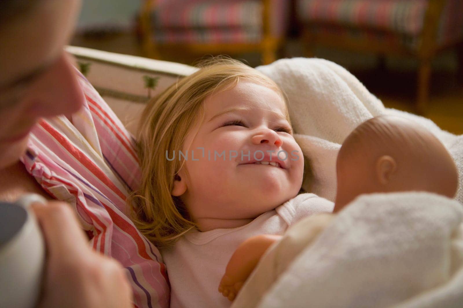 Close_up of a mid adult woman holding her baby girl