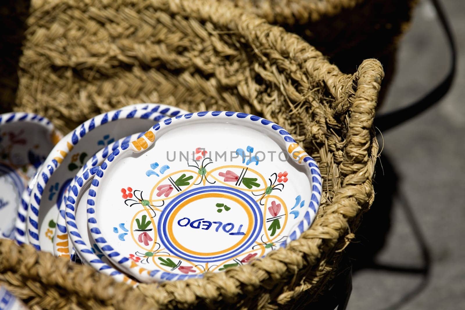 Close_up of plates in a basket