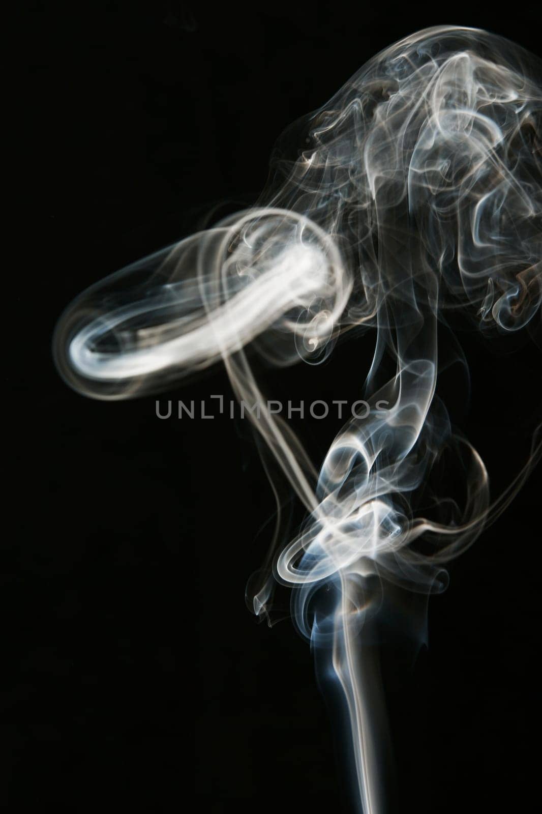 Close_up of smoke against black background