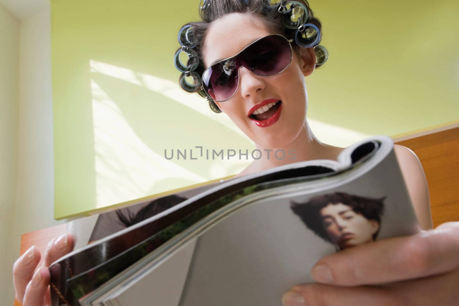 Young woman reading a magazine