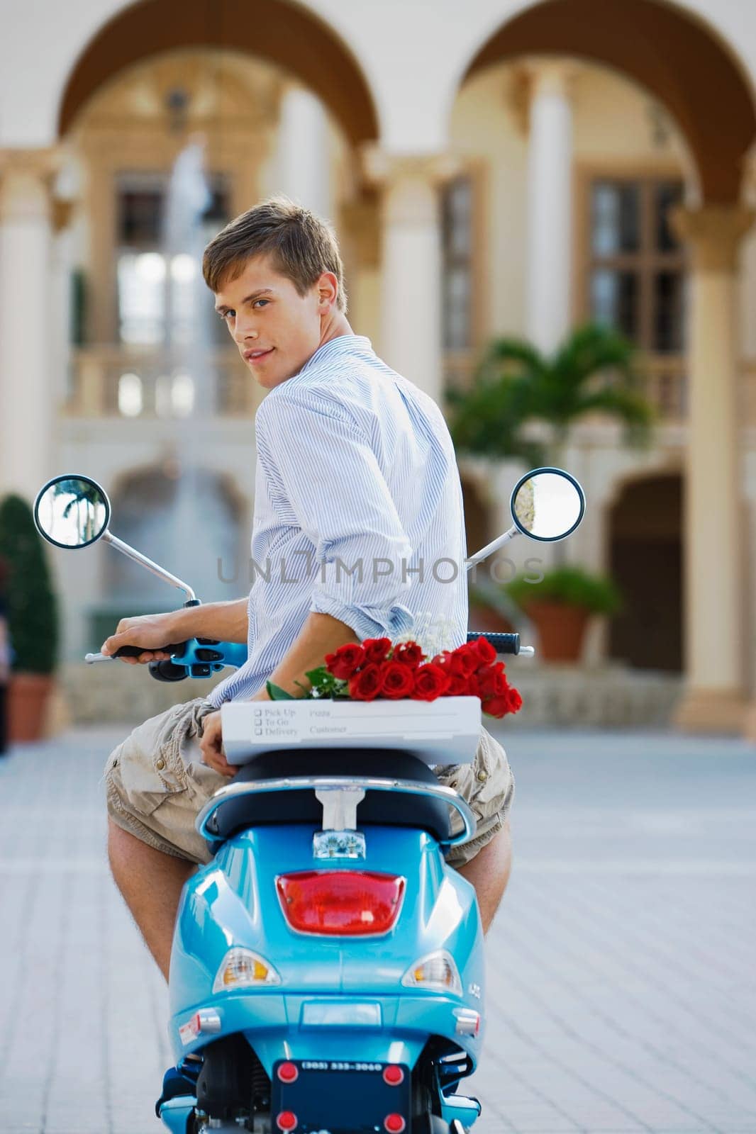 Man sitting on a moped, Biltmore Hotel, Coral Gables, Florida, USA