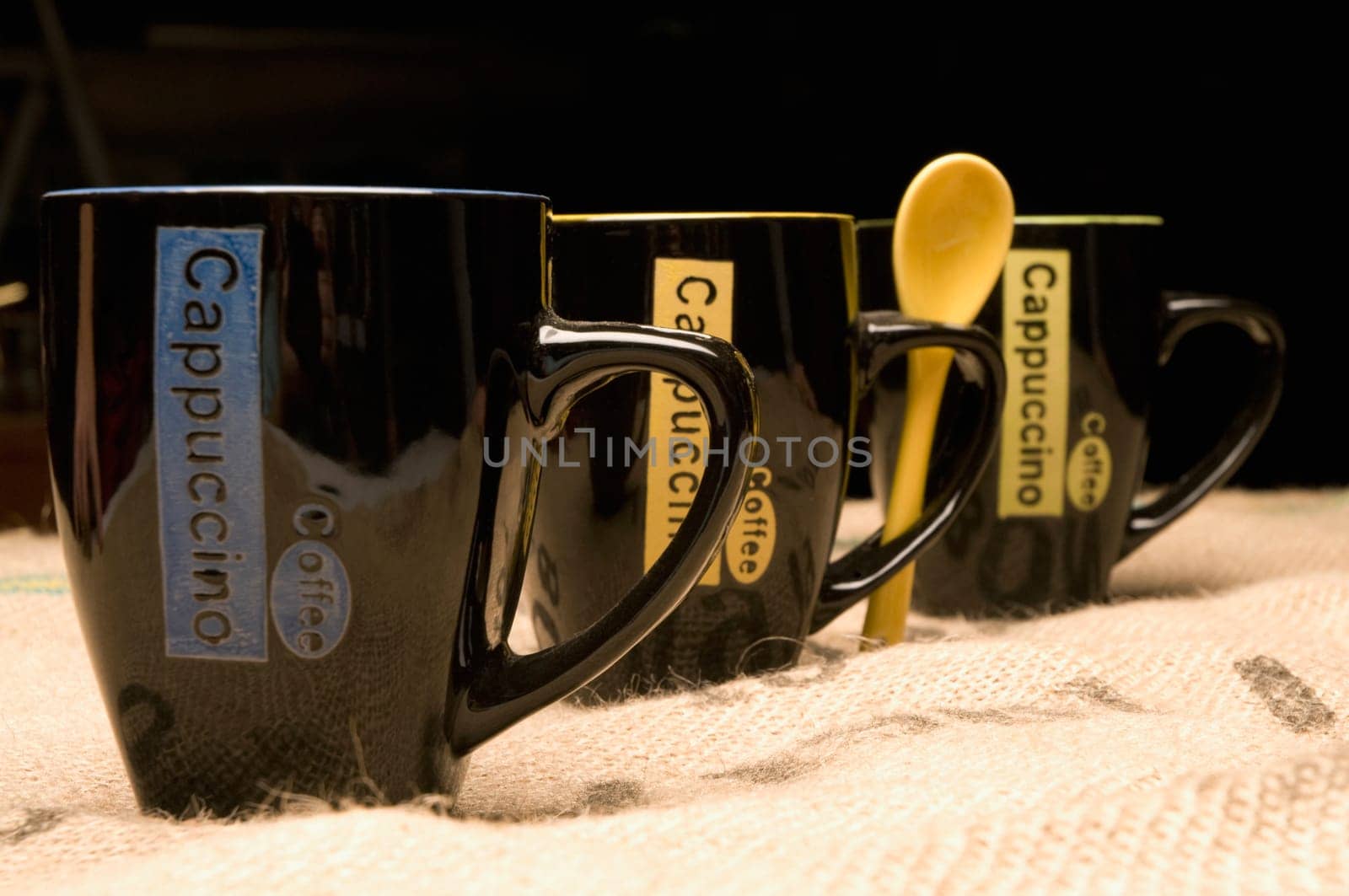 Close_up of coffee cups in a row