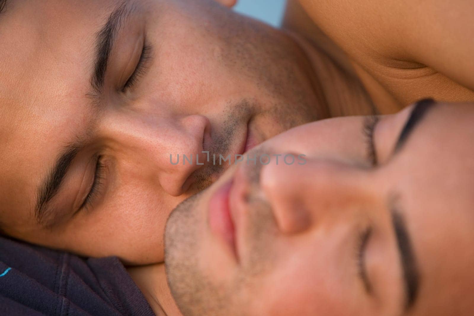 Close_up of a gay couple romancing