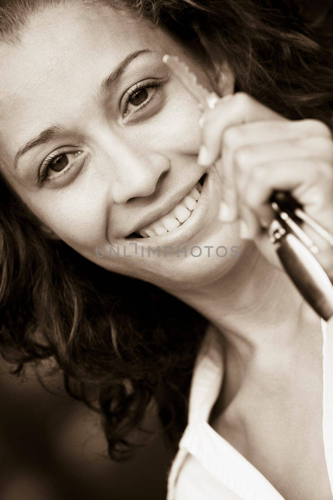 Portrait of a mid adult woman holding a car key and smiling