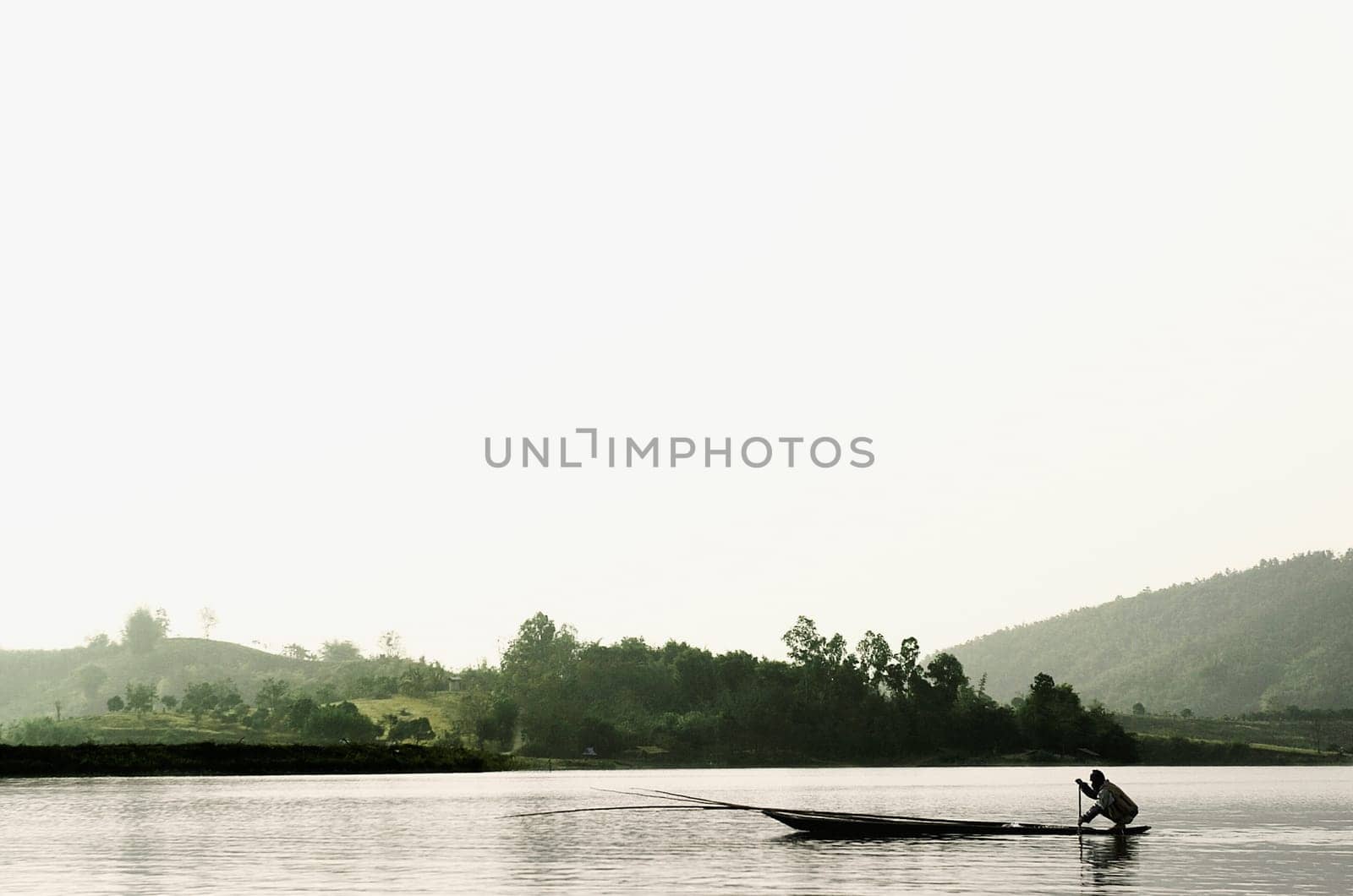 Silhouette of a person rowing a boat, Chiang Rai, Amphoe Mueang, Chiang Rai Province, Thailand