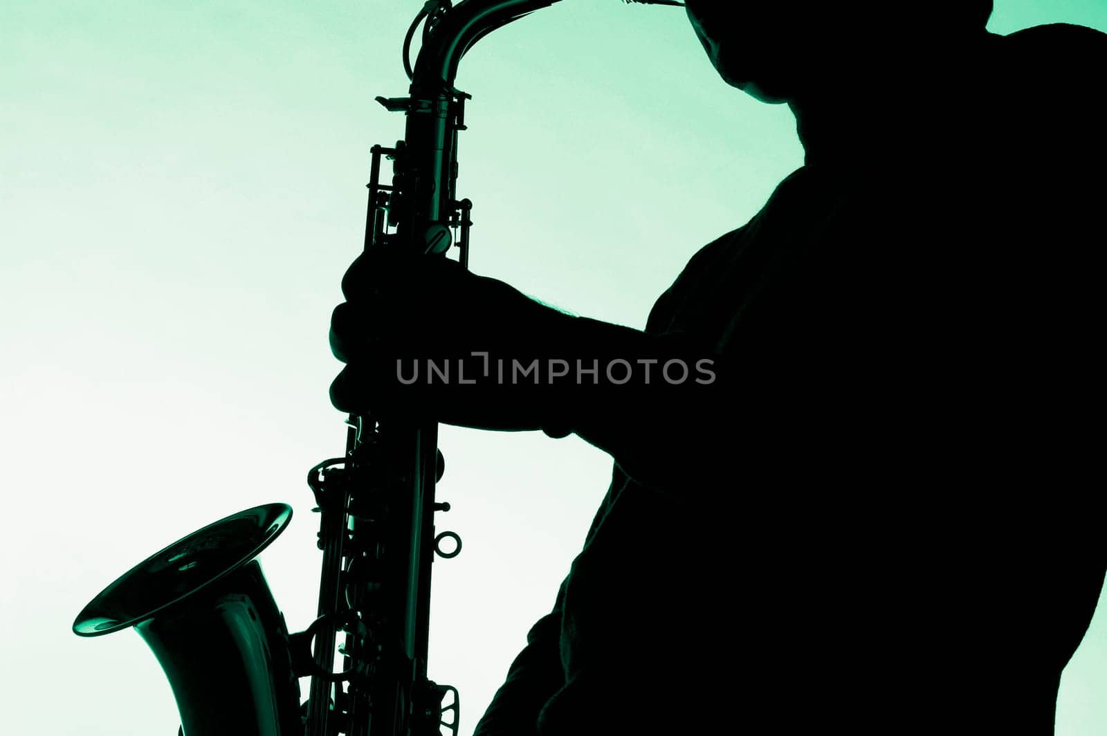 Silhouette of a musician playing a saxophone