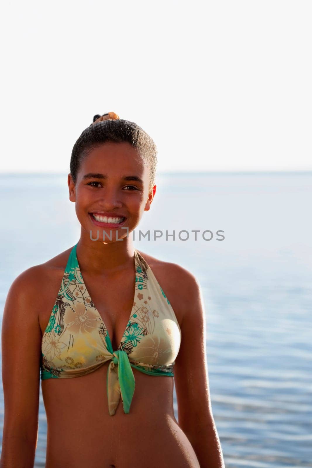 Portrait of a teenage girl smiling on the beach