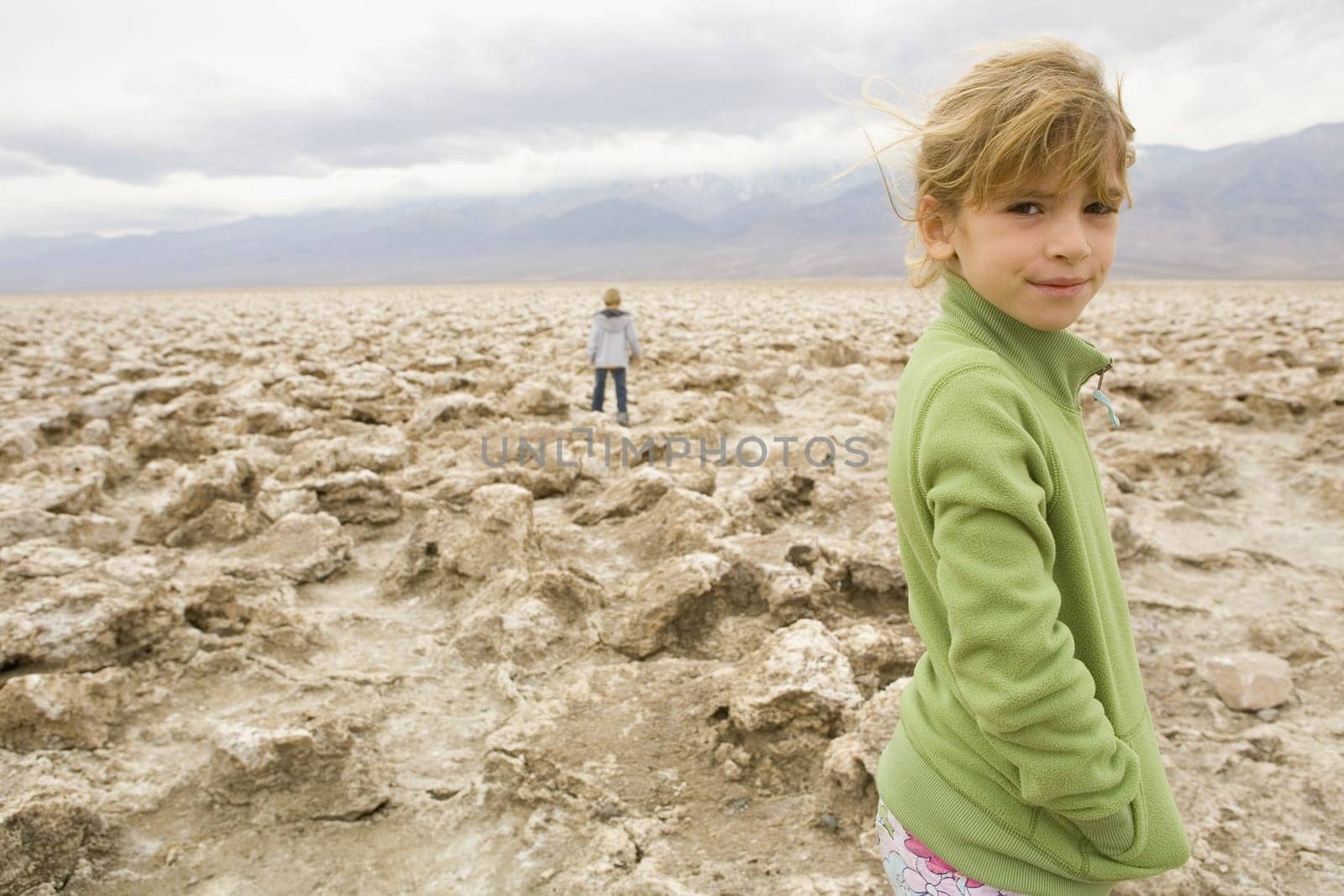 Portrait of a girl standing in a desert