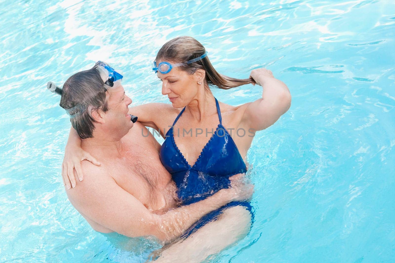 Couple romancing in a swimming pool, Biltmore Hotel, Coral Gables, Florida, USA