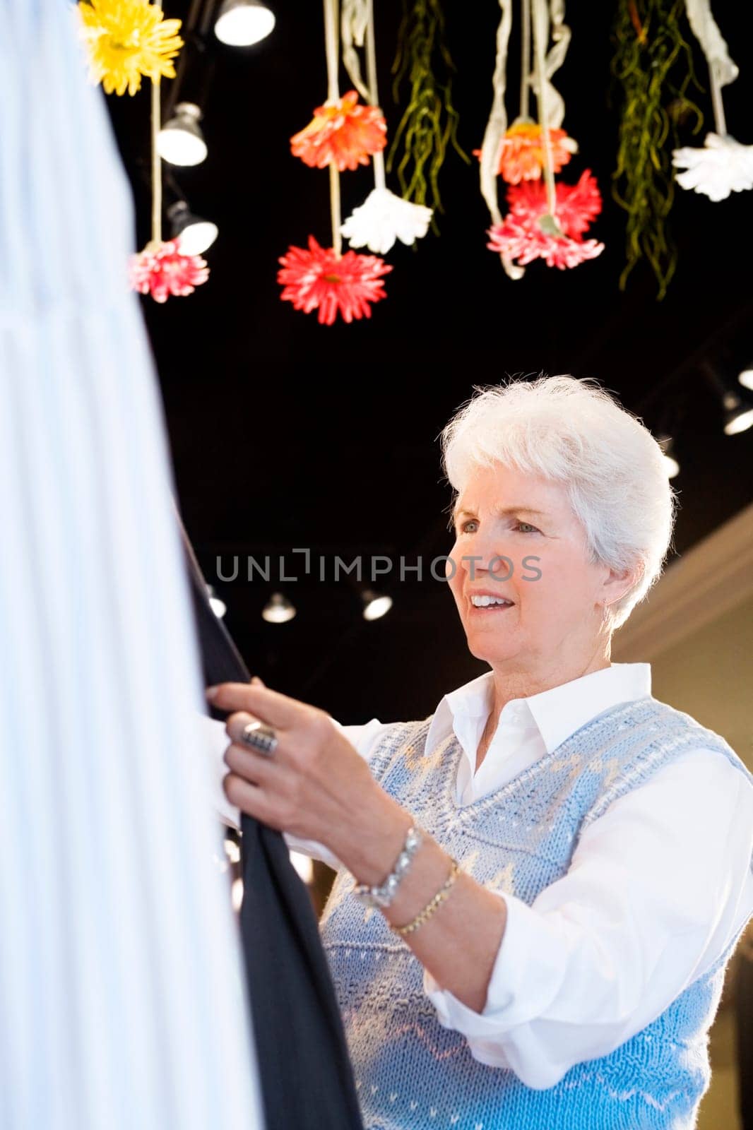 Side profile of a senior woman standing in a store