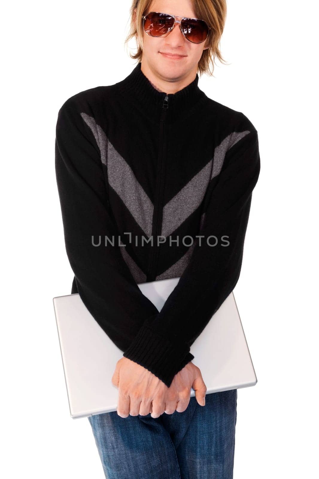 Young man holding a laptop and smiling