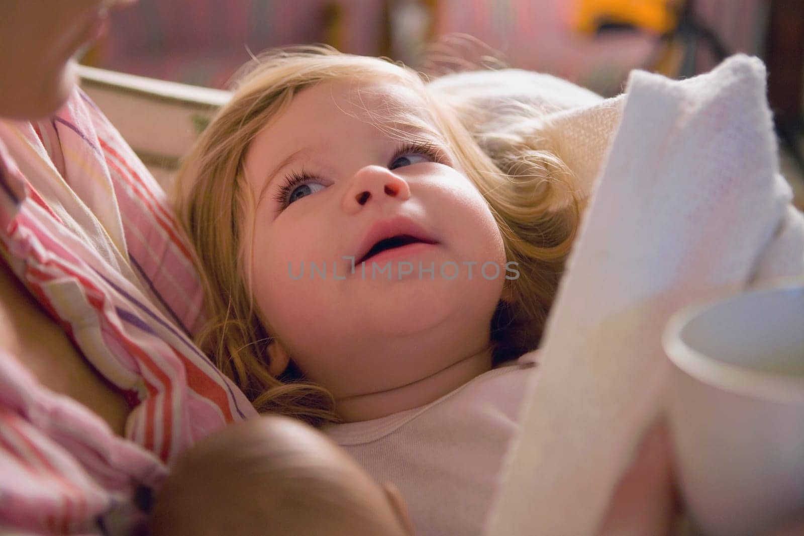 Close_up of a mid adult woman holding her baby girl