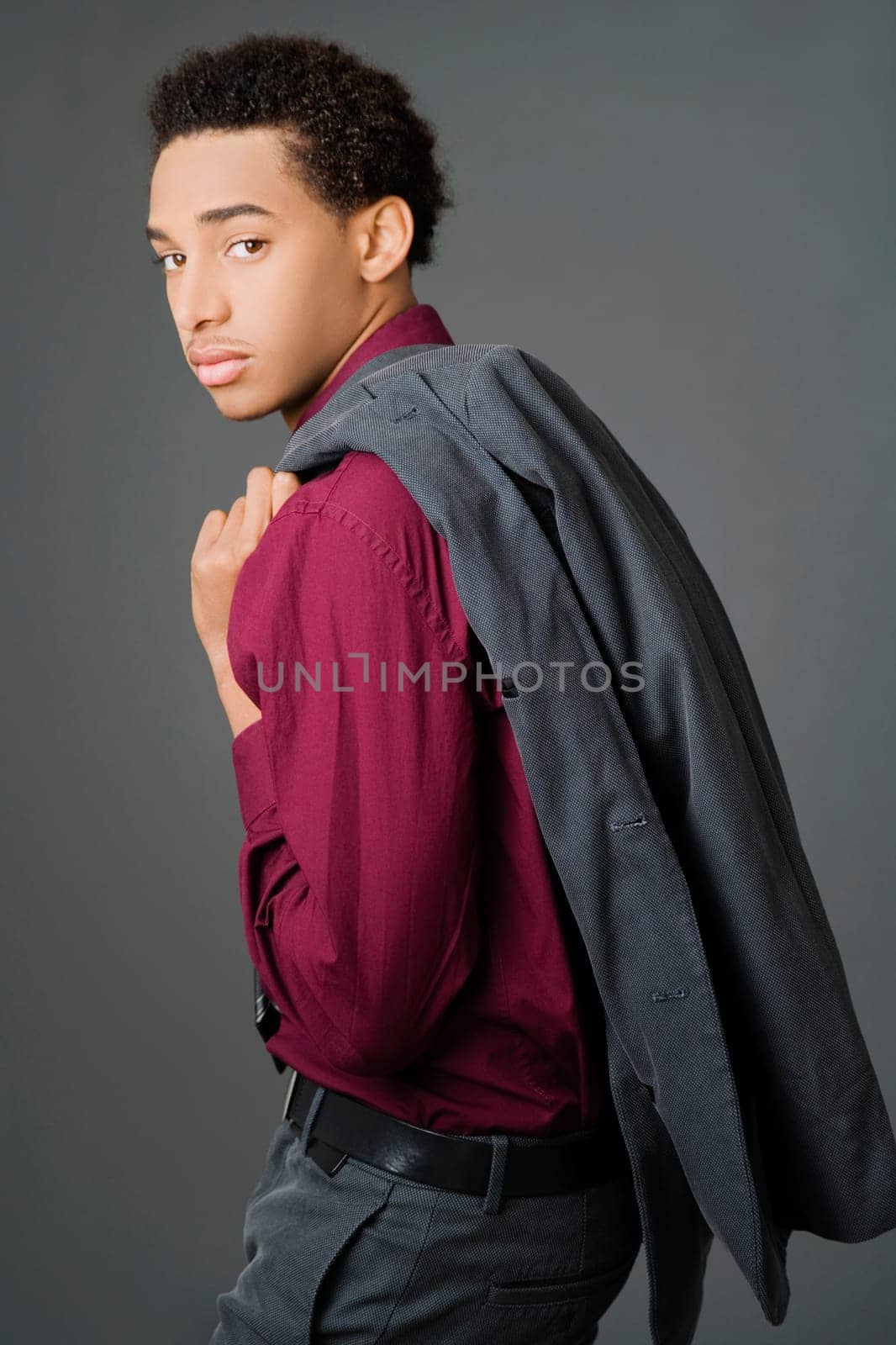 Portrait of a businessman carrying his coat over his shoulder