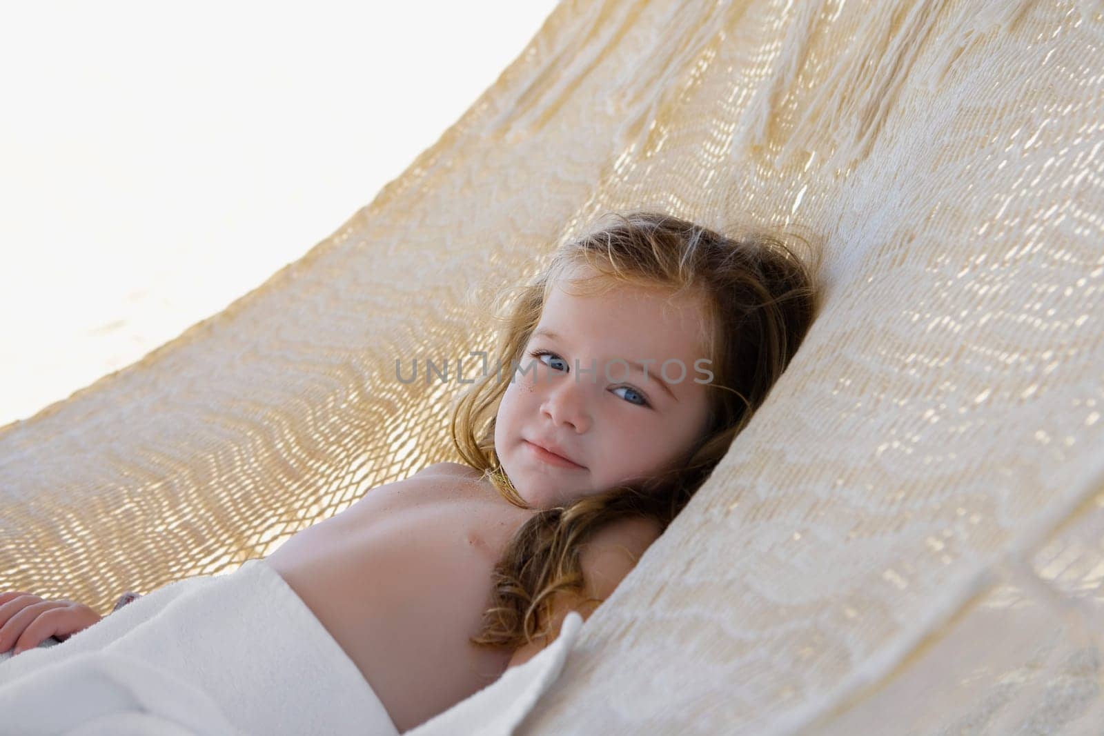 Portrait of a baby girl lying in a hammock