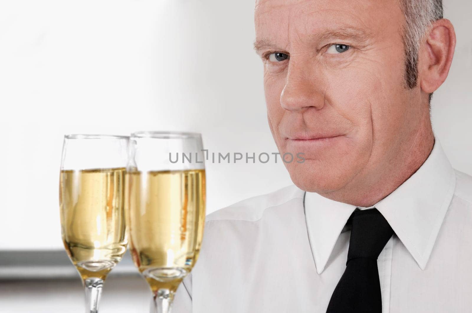Waiter holding a tray of champagne flutes