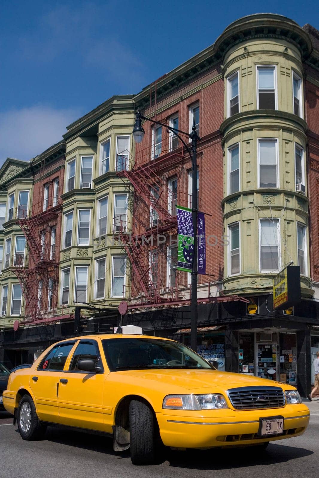 Yellow taxi on the road, Boystown, Northalsted, Chicago, Illinois, USA