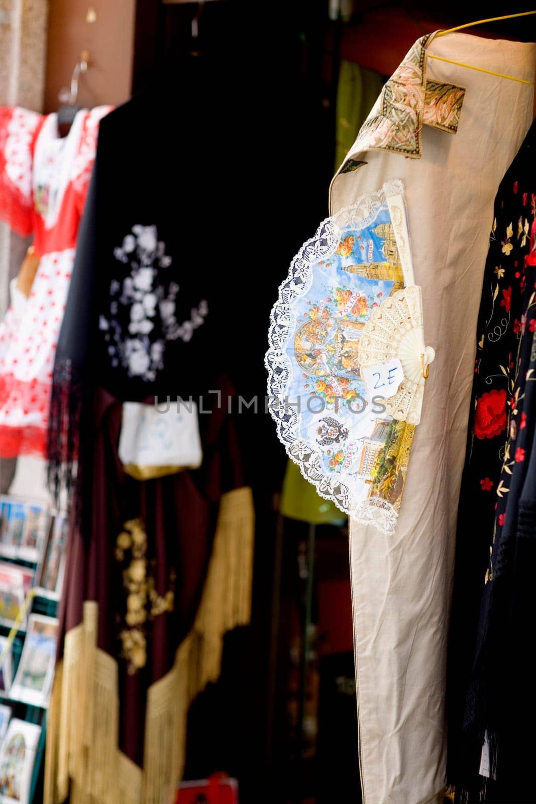 Close_up of a folding fan hanging on a clothing store, Madrid, Spain