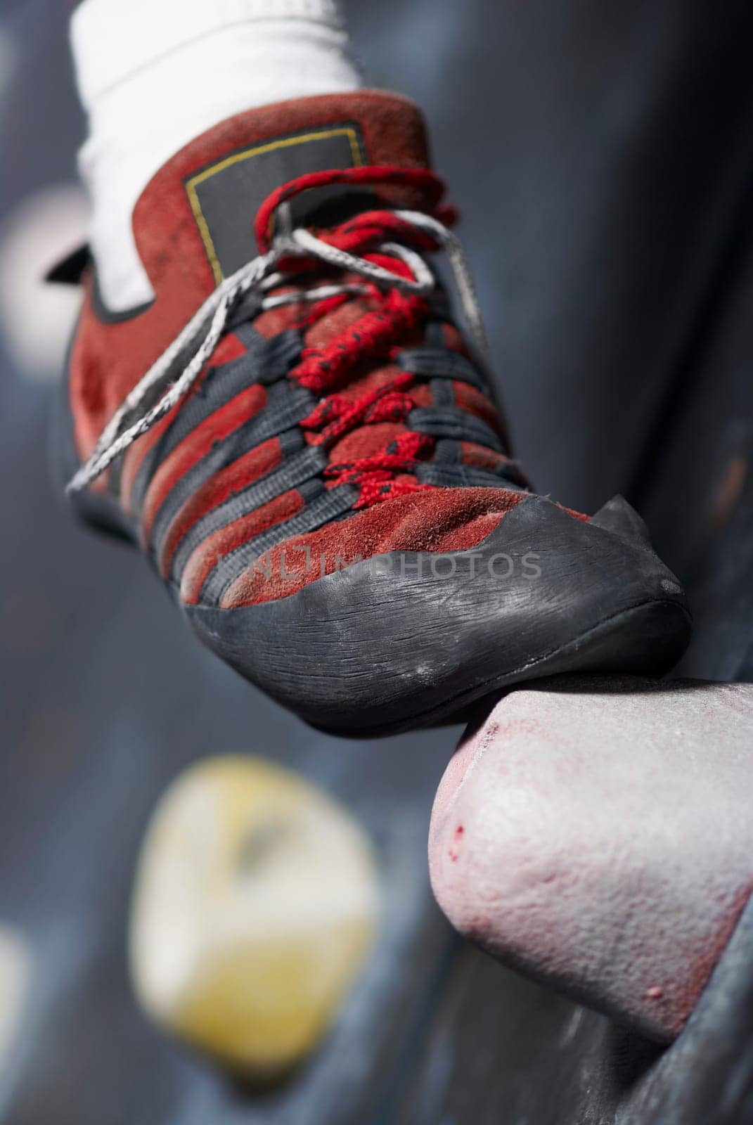 Close_up of a personŽs leg on a climbing wall