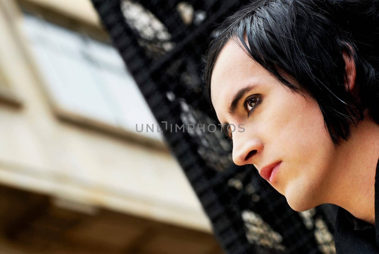 Close_up of a young man looking away