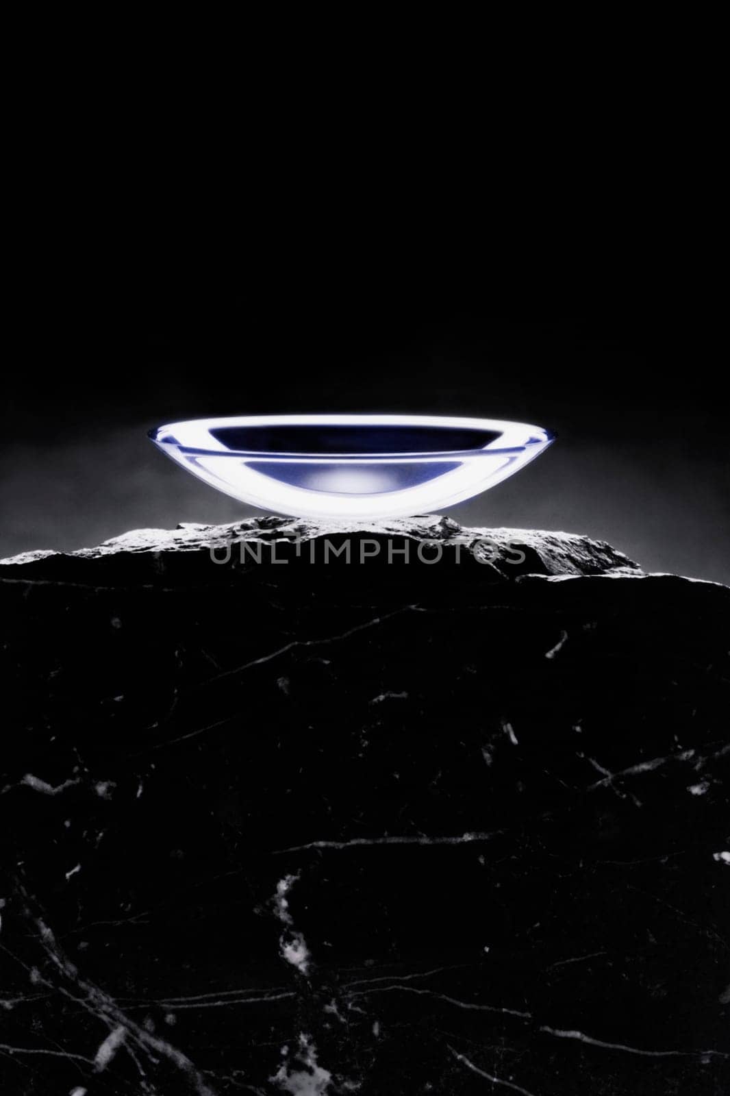 Close_up of a contact lens on a rock