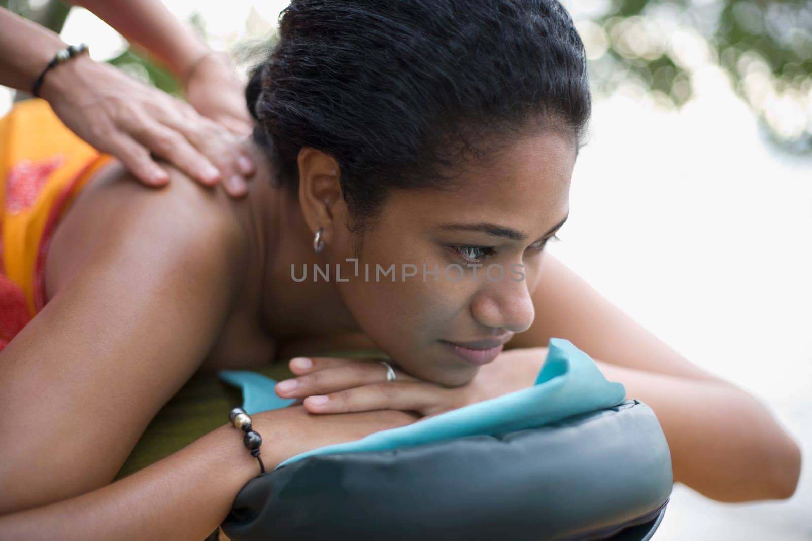 Close_up of a woman receiving a back massage