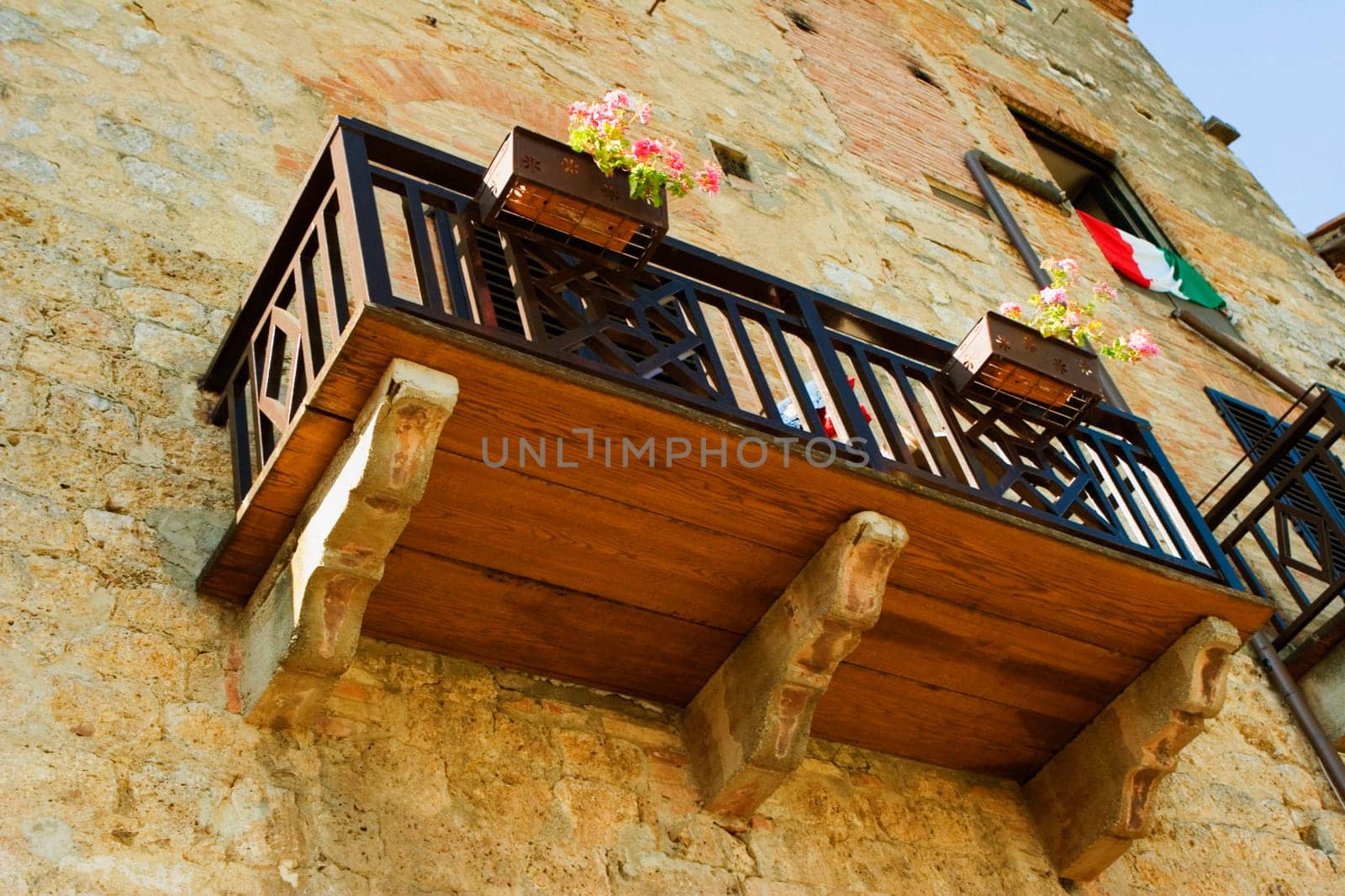 Low angle view of window boxes at a balcony, San Gimignano, Siena Province, Tuscany, Italy