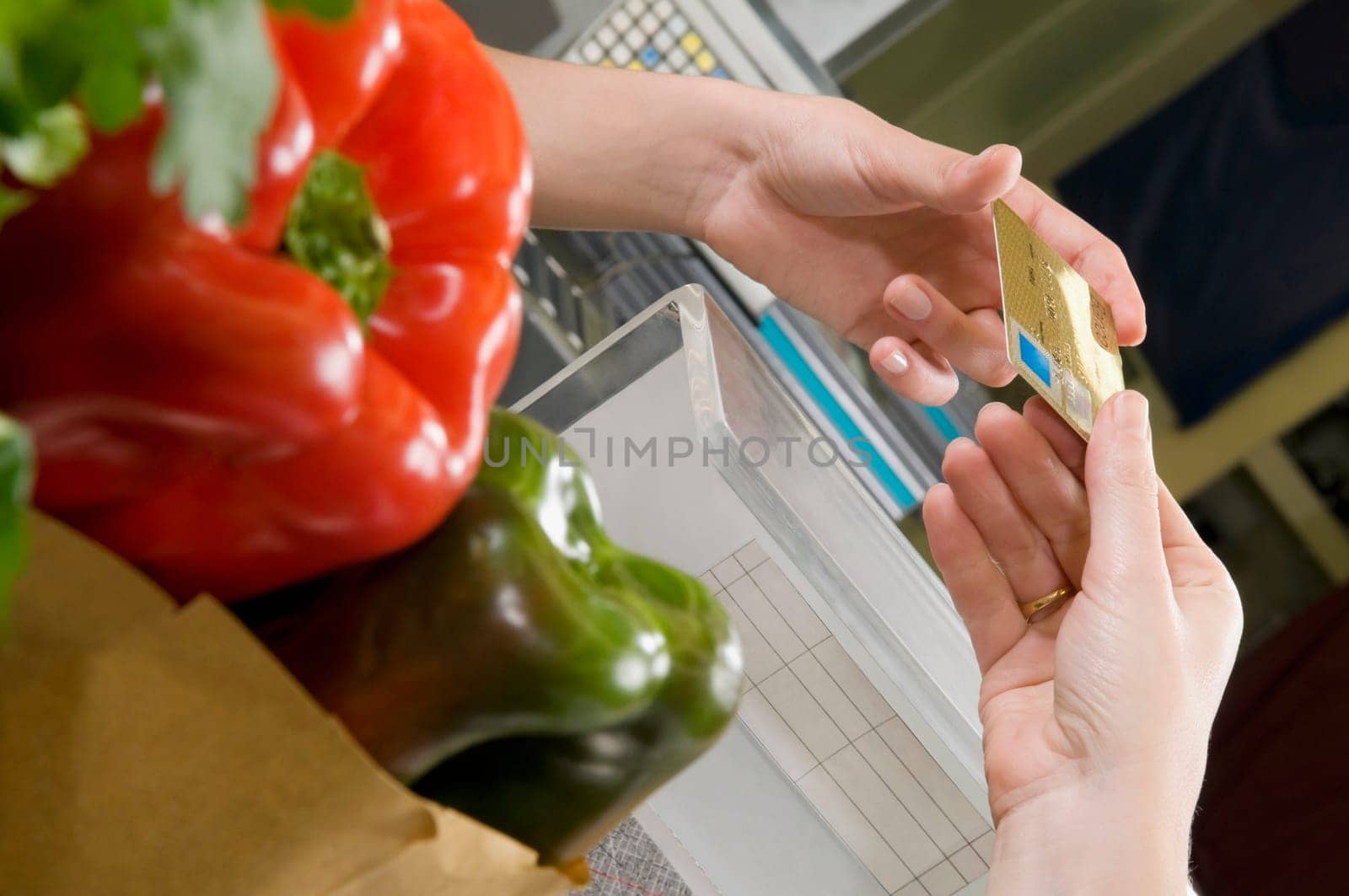 Customer making payment through credit card at the checkout counter