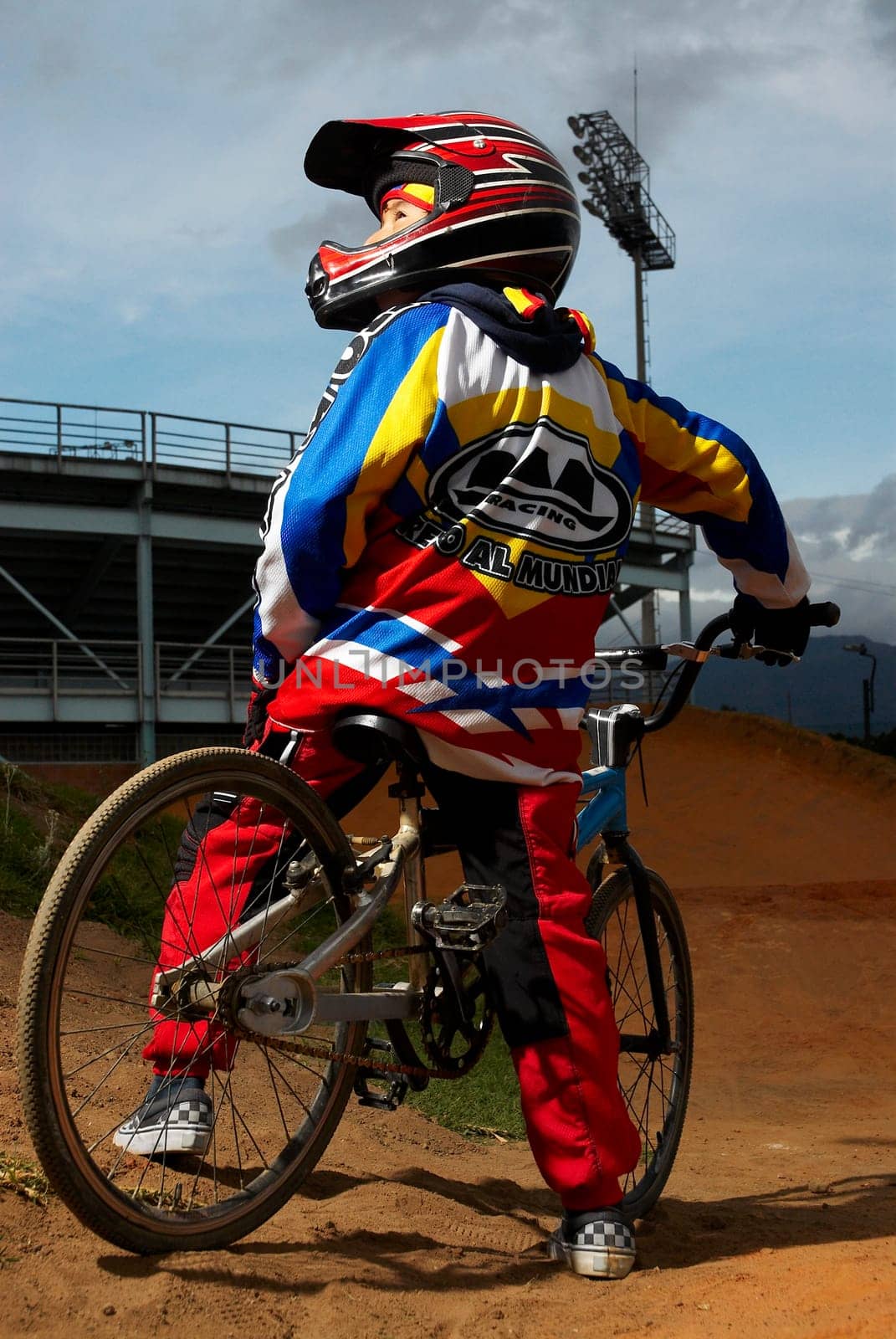 Rear view of a BMX cyclist performing