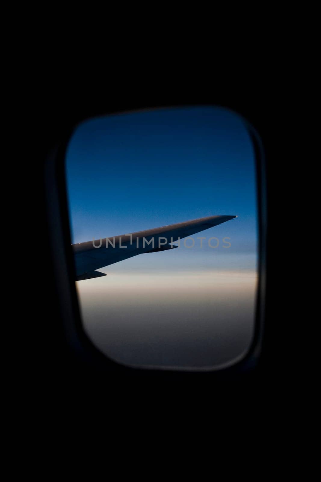 Airplane viewed through the window of another airplane