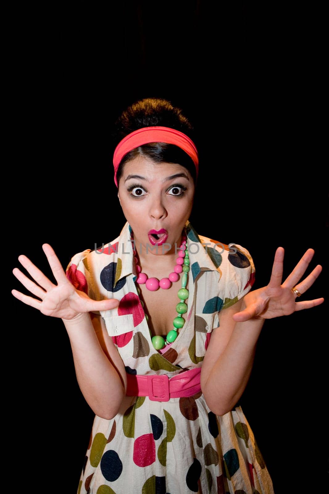 Portrait of a young woman looking shocked