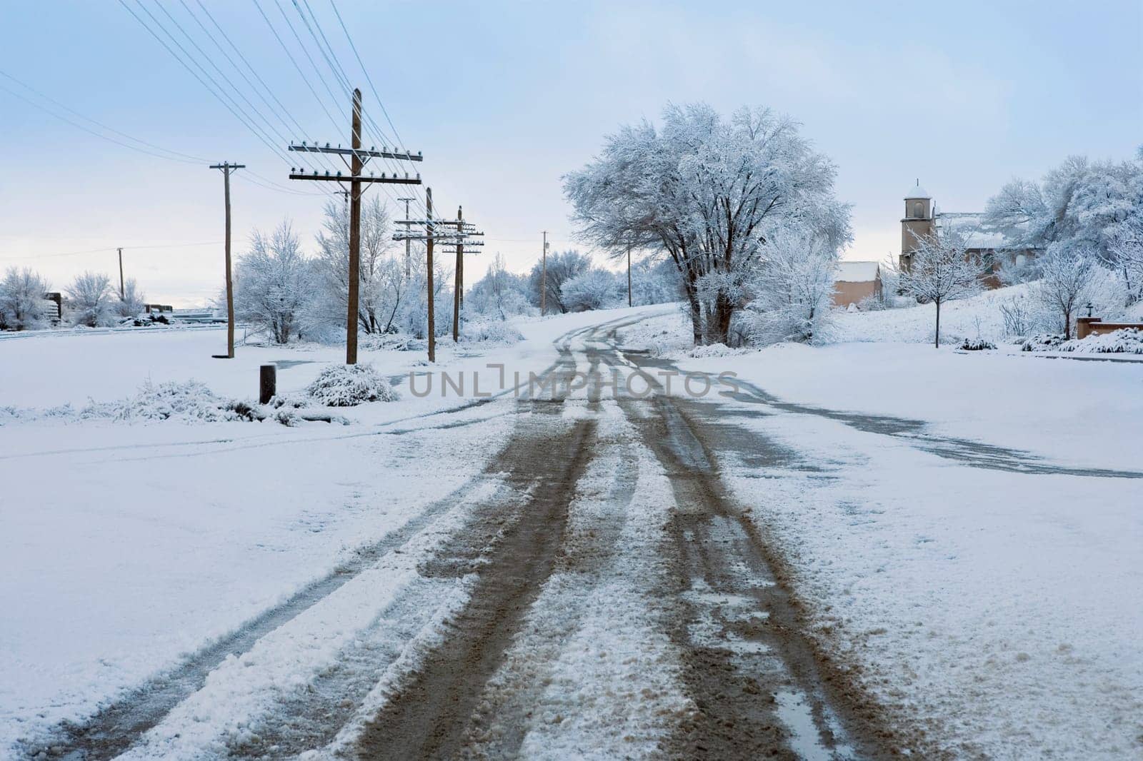 Road passing through a snow covered landscape