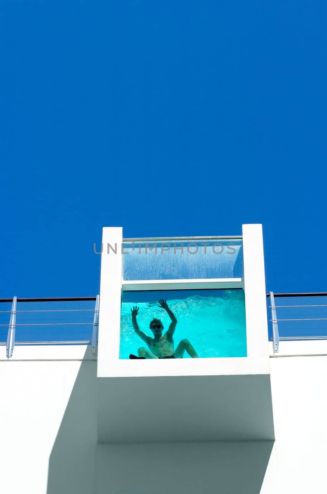 Low angle view of a man bathing in a water tank