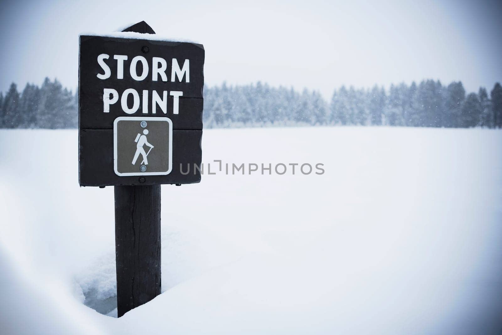 Information board in the snow, Yellowstone National Park, Wyoming, USA