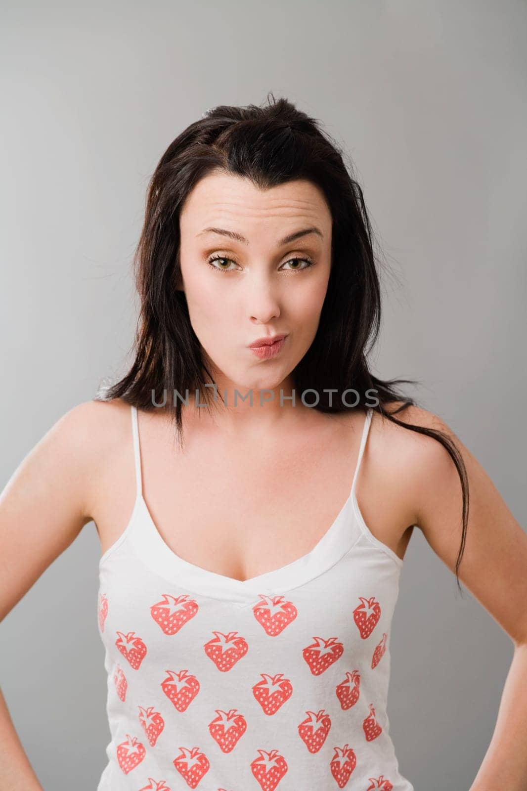 Portrait of a young woman making a face