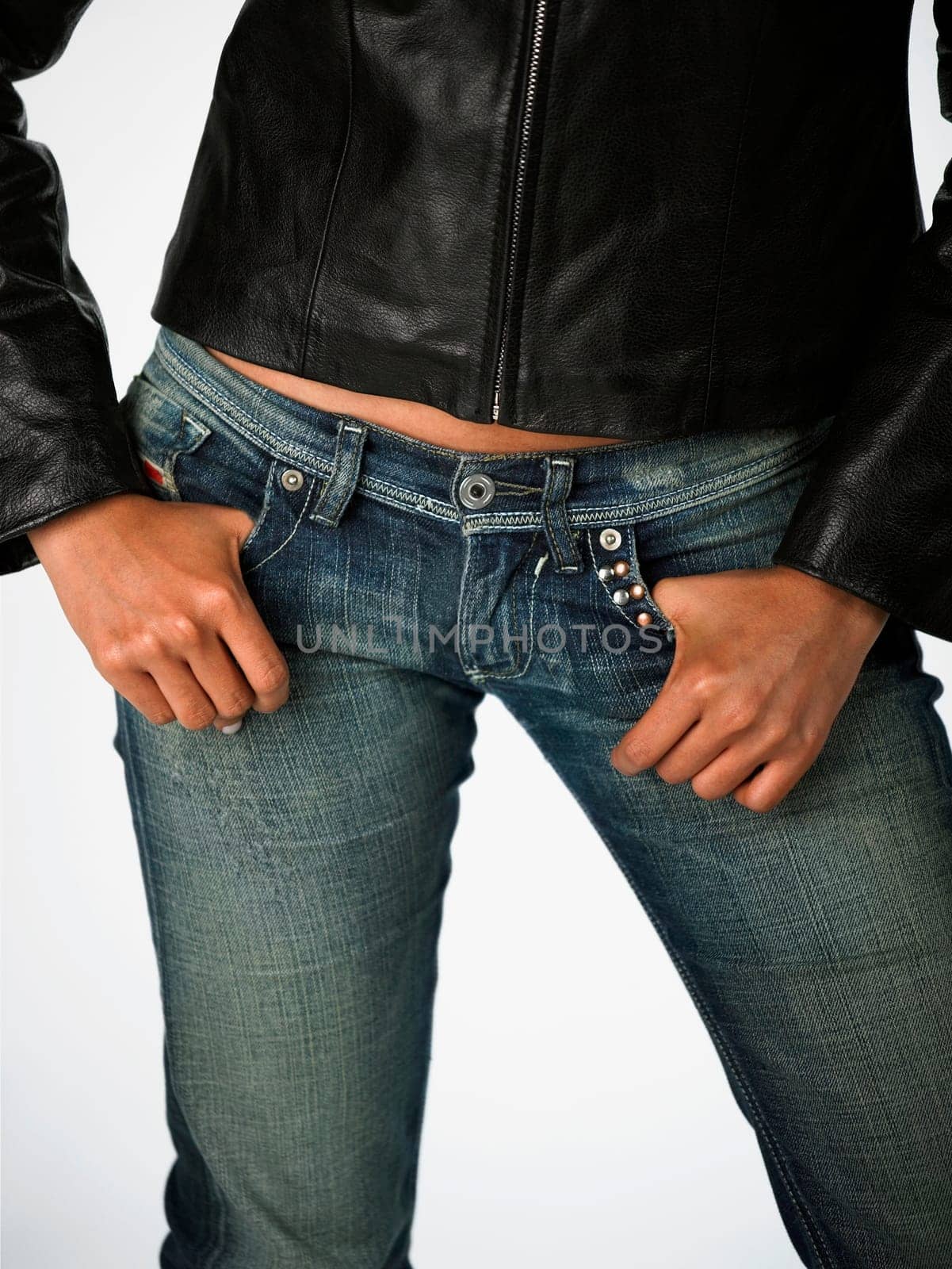 Mid section view of a woman with her hands in her pockets