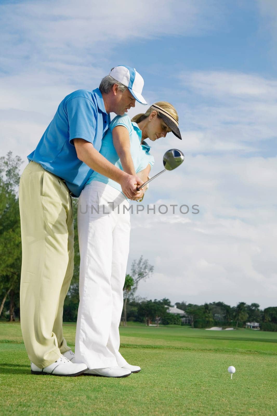 Golf instructor teaching golf to a woman, Biltmore Golf Course, Coral Gables, Florida, USA