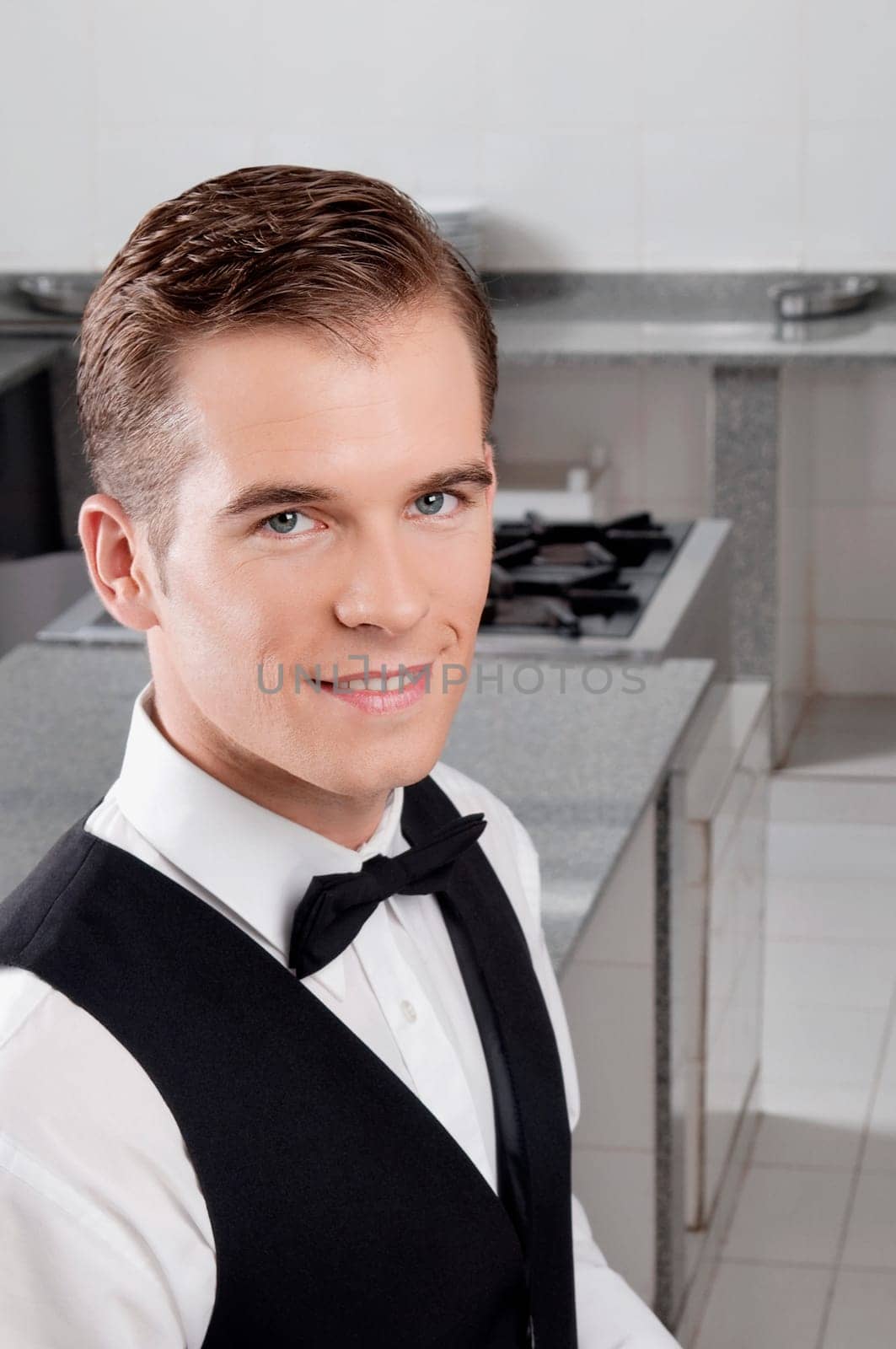 Portrait of a waiter smiling