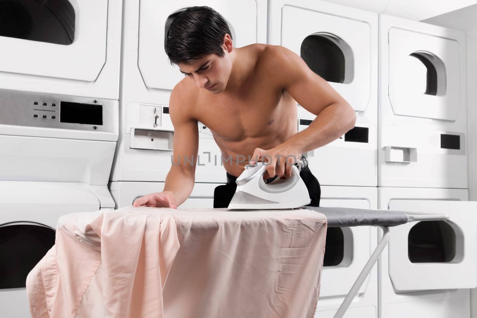 Man ironing a shirt