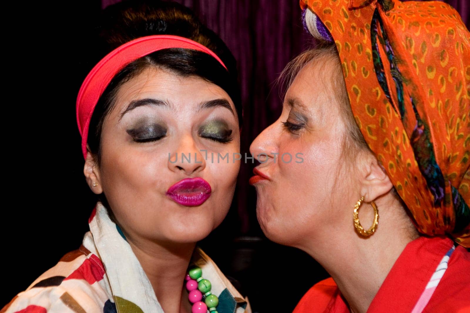 Close_up of a mature woman kissing her daughter