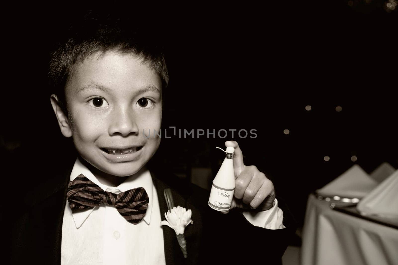 Portrait of a boy holding a spray bottle